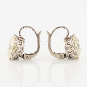 A pair of earrings in 18K white gold set with two old-cut diamonds.