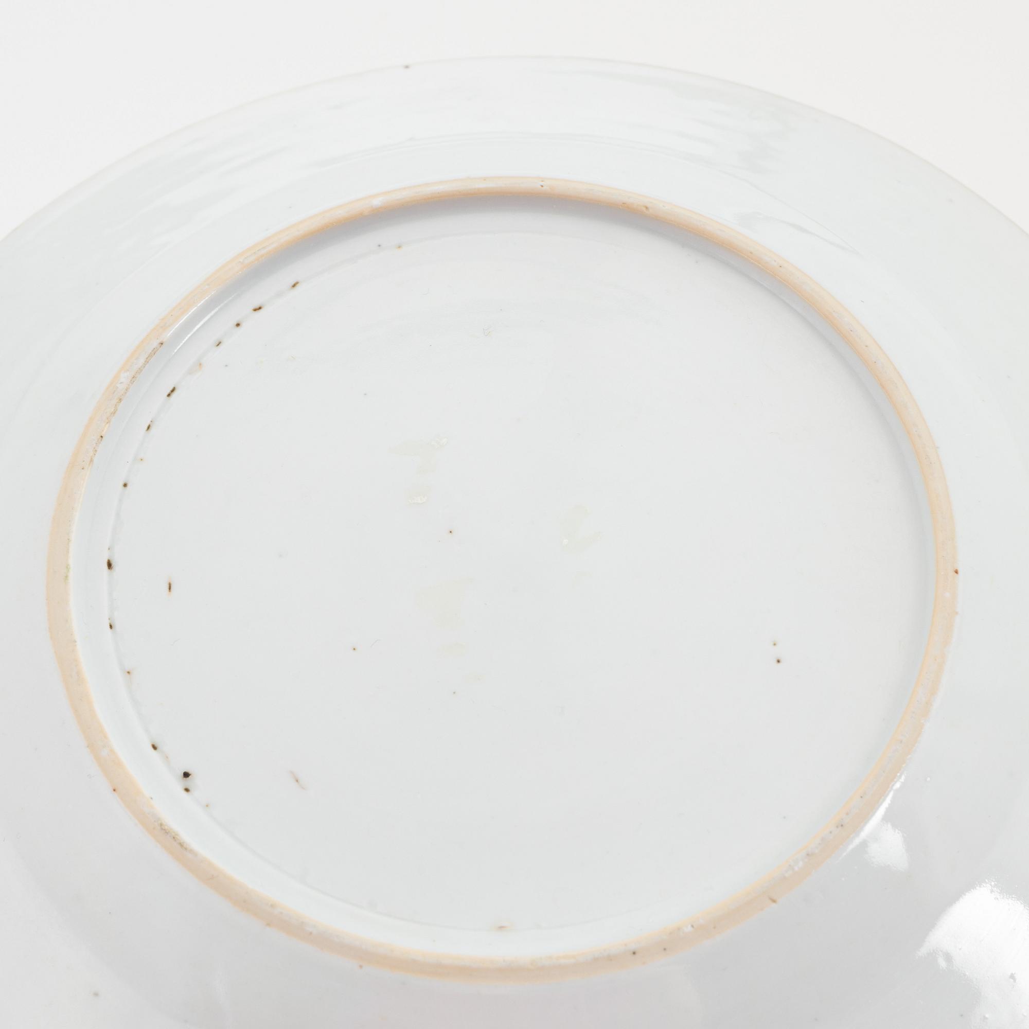 A group of nine Chinese famille rose porcelain plates, Qing dynasty, Yongzheng (1723-35) and Qianlong (1736-95).