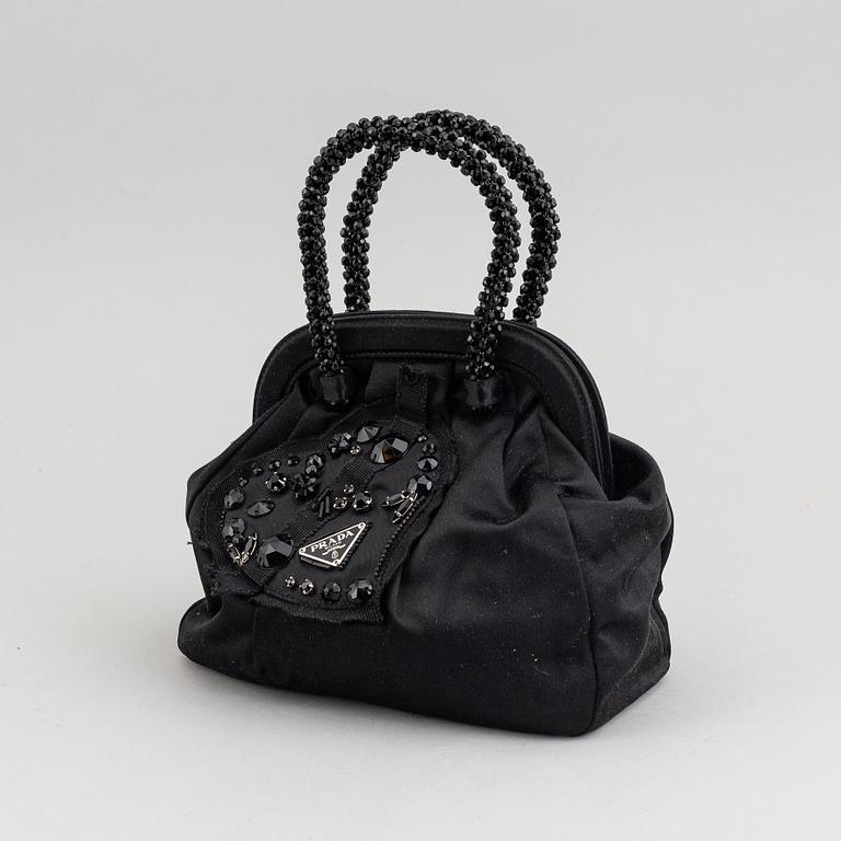 Prada, an evening bag.