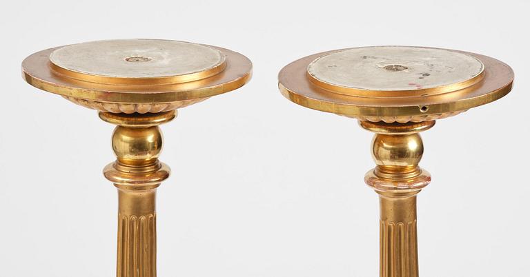 A pair of late Gustavian giltwood torchères by J. Frisk (master in Stockholm 1805-24).