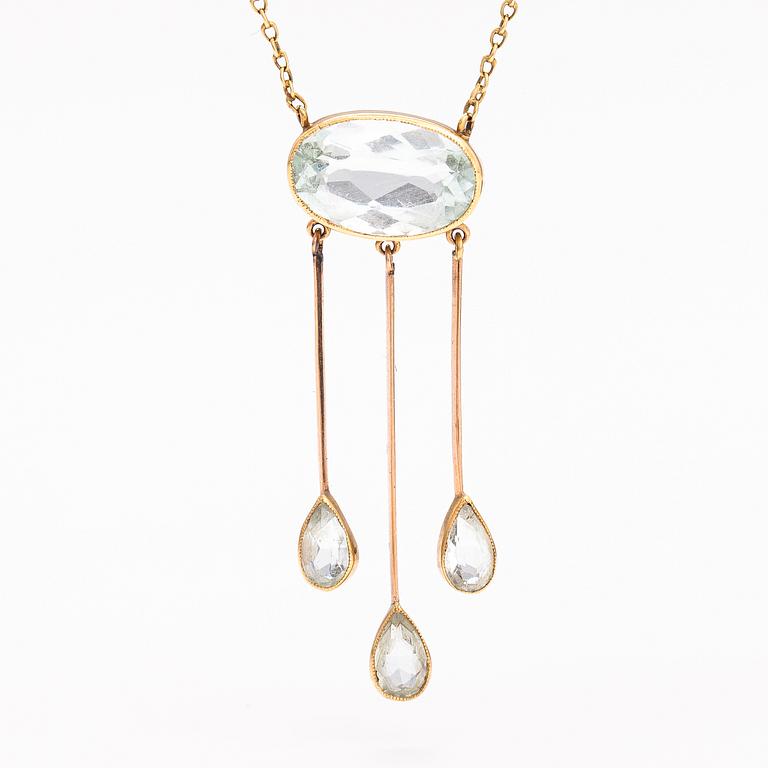 An 18K and 14K gold necklace with aquamarines.