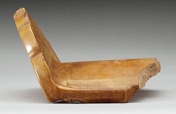 A yellow glazed end-tile, with dragon in relief, Ming dynasty (1368-1644).