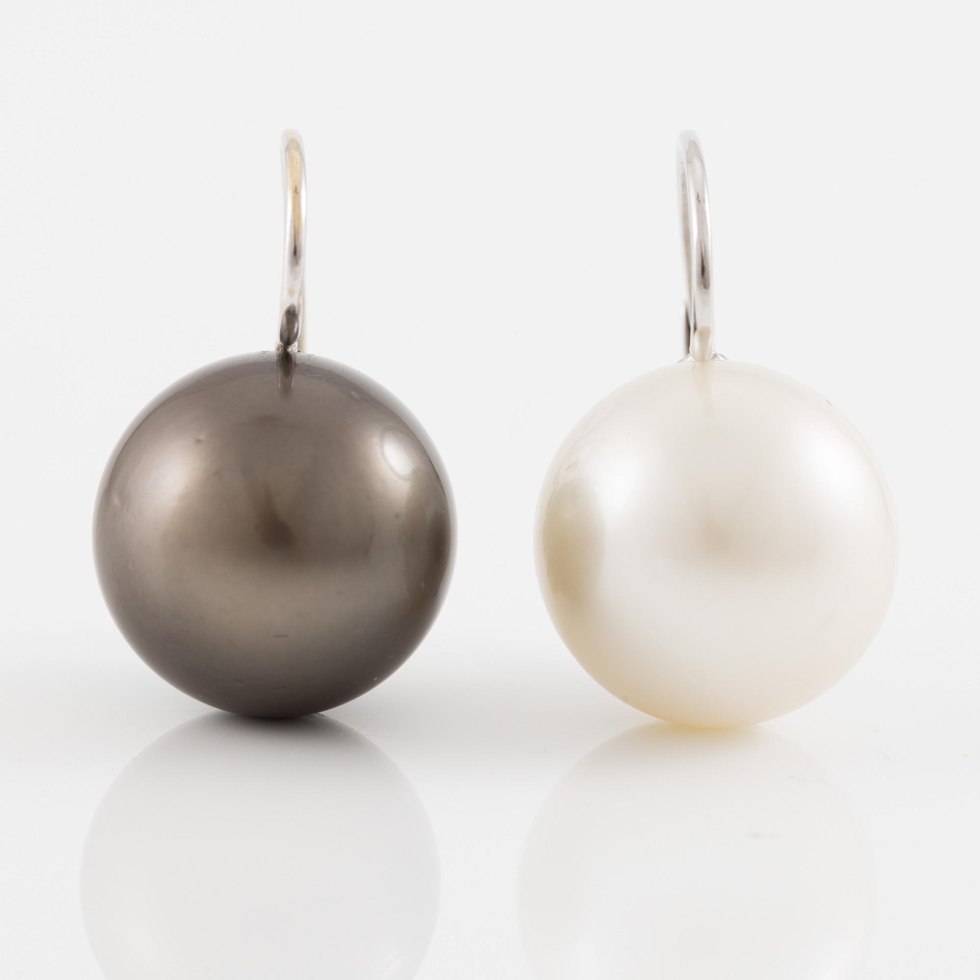 Earrings with cultured Tahitian and South Sea pearls.