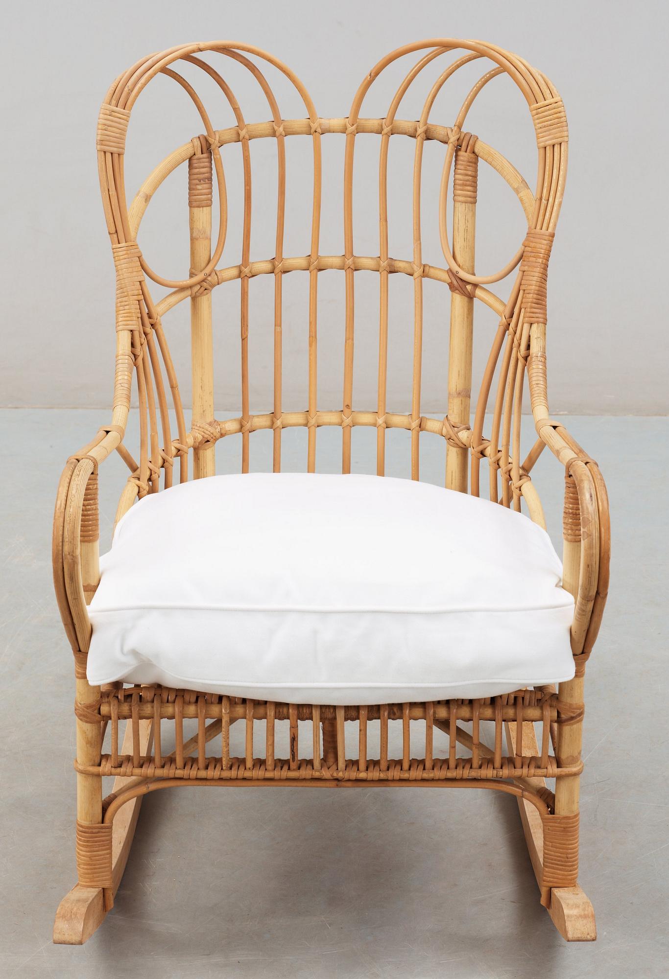 A Josef Frank ratten and beech rocking chair, Svenskt Tenn, model 1077, 1940's-50's.