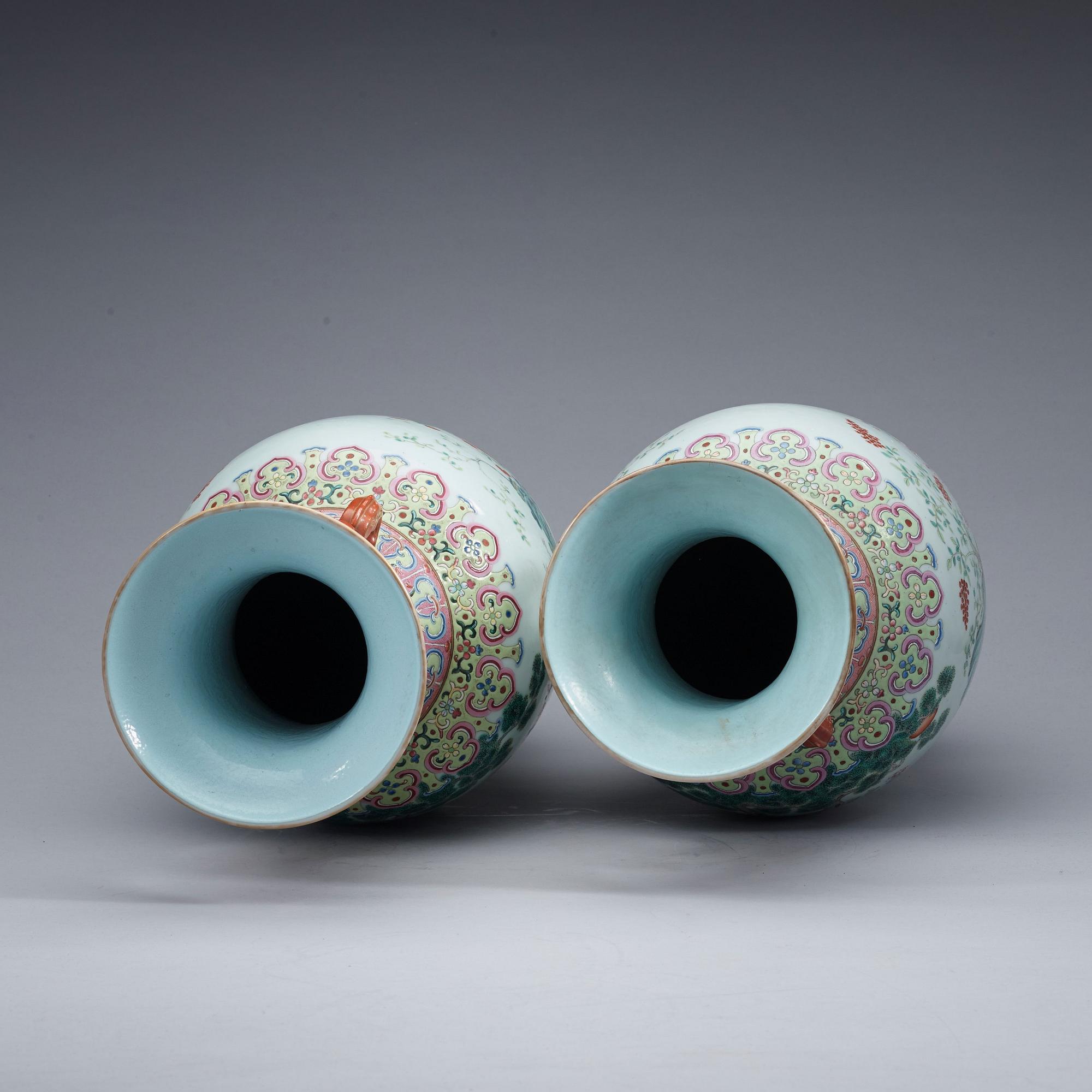 A pair of famille rose vases, Qing dynasty with Qianlong seal mark.