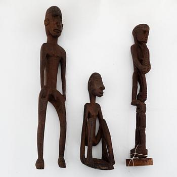 A group of three hardwood Asmat scultpures, Indonesia, 20th Century.