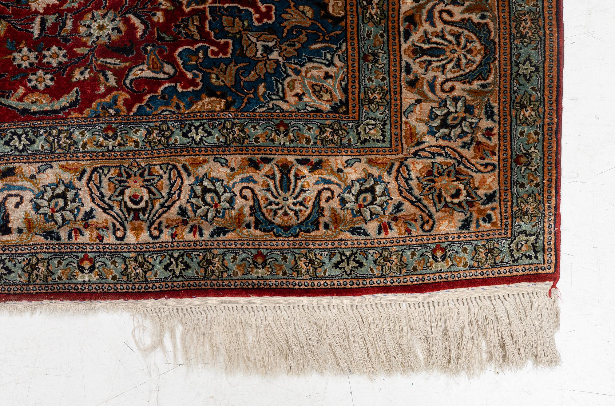 A silk Kashmir rug, c. 176 x 121 cm.