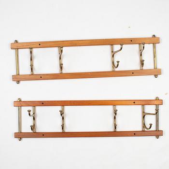 A pair of 'Dekorativ' coat hangers, Skoglunds metallgjuteri, Anderstorp, mid 20th Century.