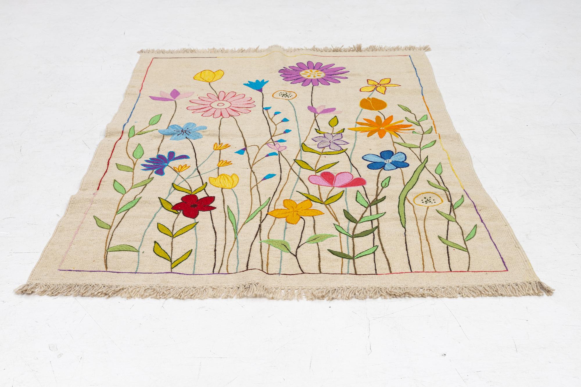 A hand-embroidered Kelim, c. 182 x 123 cm.