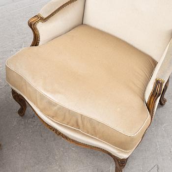 A pair of Louis XV-style lounge chairs, 20th Century.