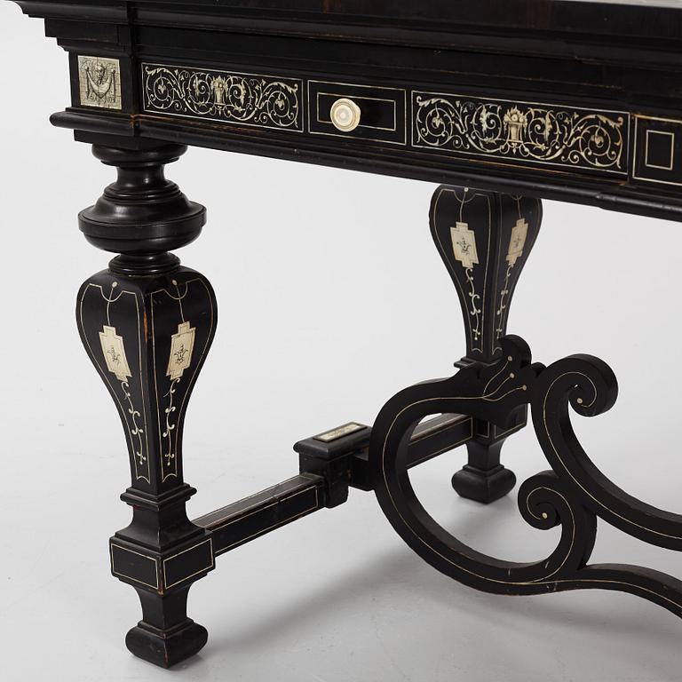 A Renaissance-style ebony, ebonized and ivory-inlaid library table, late 19th century, presumably Germany.