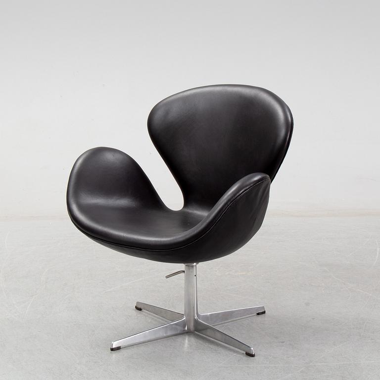 Arne Jacobsen, a black leather 'Swan' chair, Fritz Hansen, Denmark, 1967.