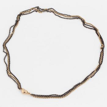 A necklace by Ole Lynggaard, the clasp decorated with a diamond.