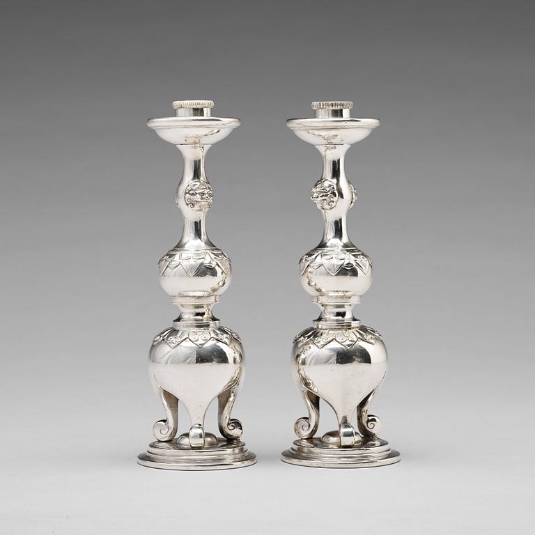 A pair of Chinese silver candle sticks, Shanghai, early 20th Century.