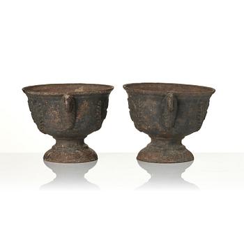 A pair of cast-iron garden urns, presumably from Näfveqvarns styckebruk, dated 1789.