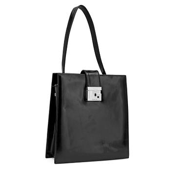 GUCCI, a black patent leather handbag.