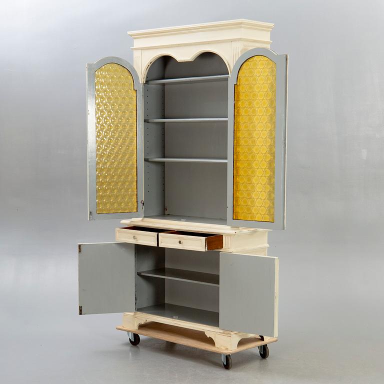 A modern painted display cabinet.