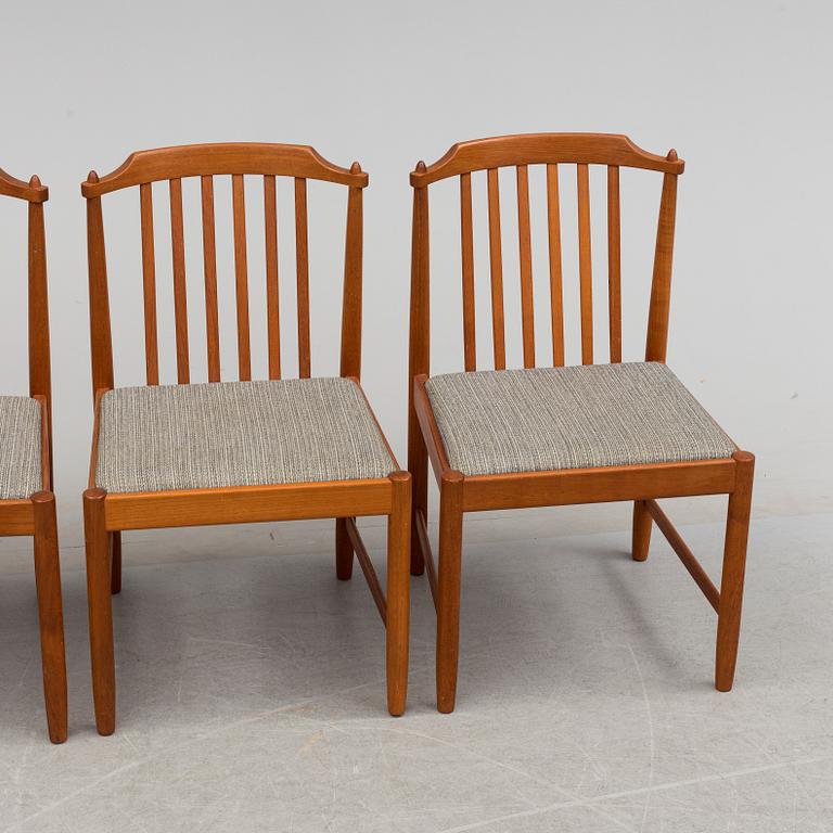 A 20th century table and four chairs.