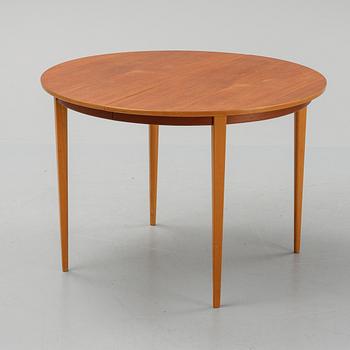 A teak dining table with 4 'Monaco' chairs, mid 20th century.