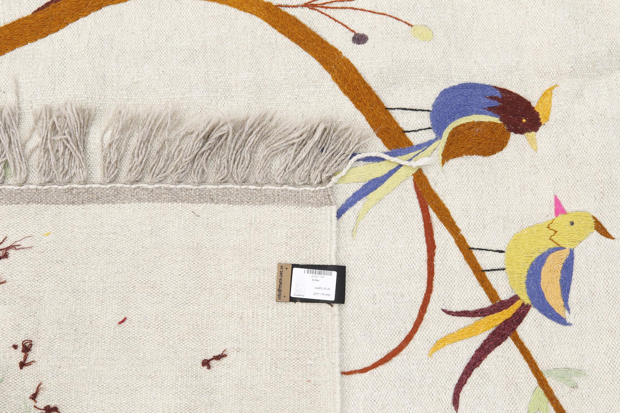 An embroided oriental flat weave carpet, circa 225 x 175 cm.