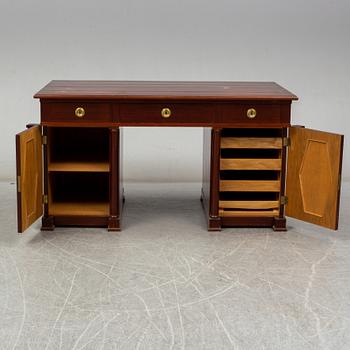 An early 20th century writing desk with chair.