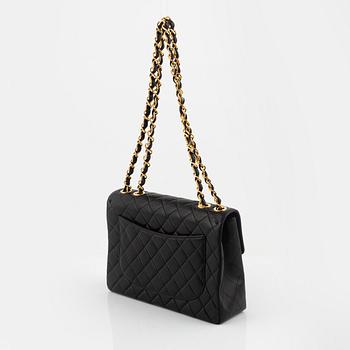 Chanel, a black leather Jumbo Flap Bag, 1997-1999. - Bukowskis