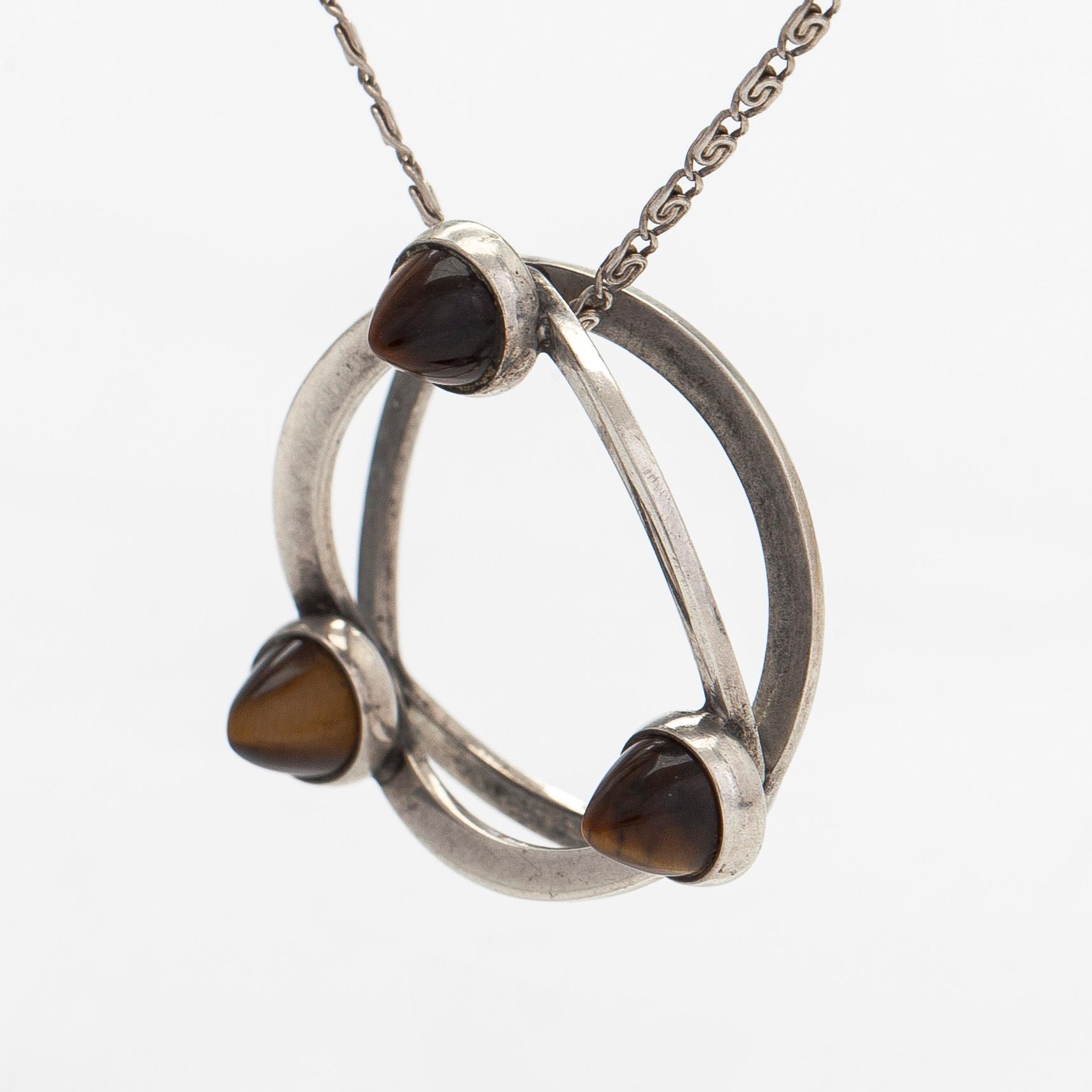 Elis Kauppi, a silver and tiger's eye pendant, Kupittaan Kulta, Turku. With chain in silver.