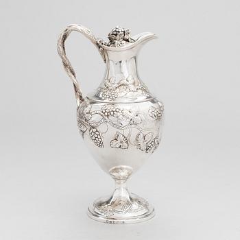 A George III sterling silver ewer by John Scofield, London, 1787.