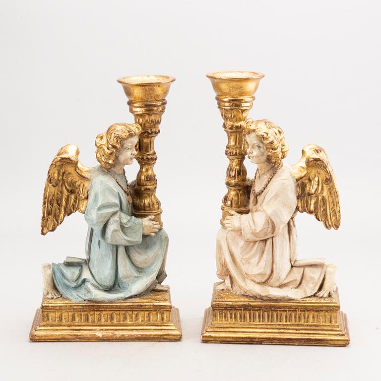 A pair of mid 20th century wood candle sticks from Paoletti, Firenze Italy.