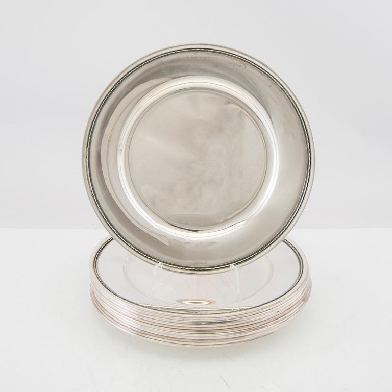 A set of 12 silver plates mark of GAB Stockholm 1963, total weight 6000 grams.