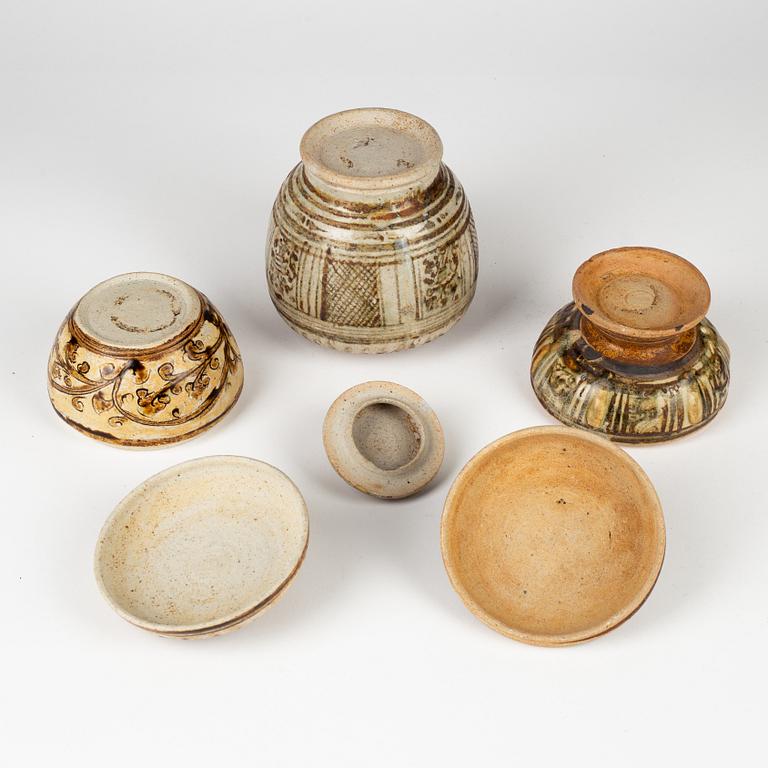 A group of three brown Sawankhalok jars with covers, Thailand, 14th/17th Century.