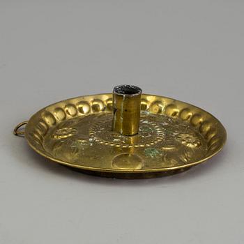 A BRASS CANDLESTICK and a GRATER, 18th century.