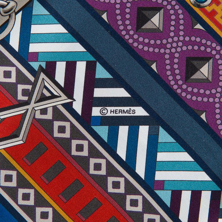 Hermès, a 'Collier de Chiens Maxi Twilly' silk scarf.