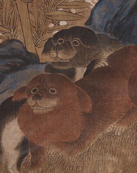 A painting of two playing dogs in front of a garden rock, late Qing dynasty (1644-1912).