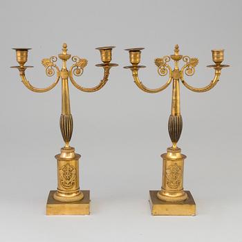 A pair of early 19th century ormolu candlestick.