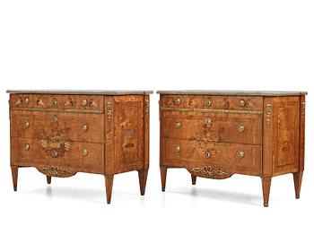 A matched pair of Gustavian ormolu-mounted limestone topped and marquetry commodes by C. Lindborg, late 18th century.