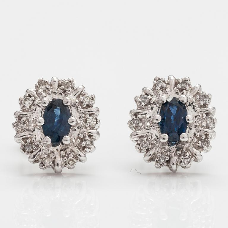 A pair of 14K white gold earrings with sapphires and diamonds ca 0.05 ct in total.