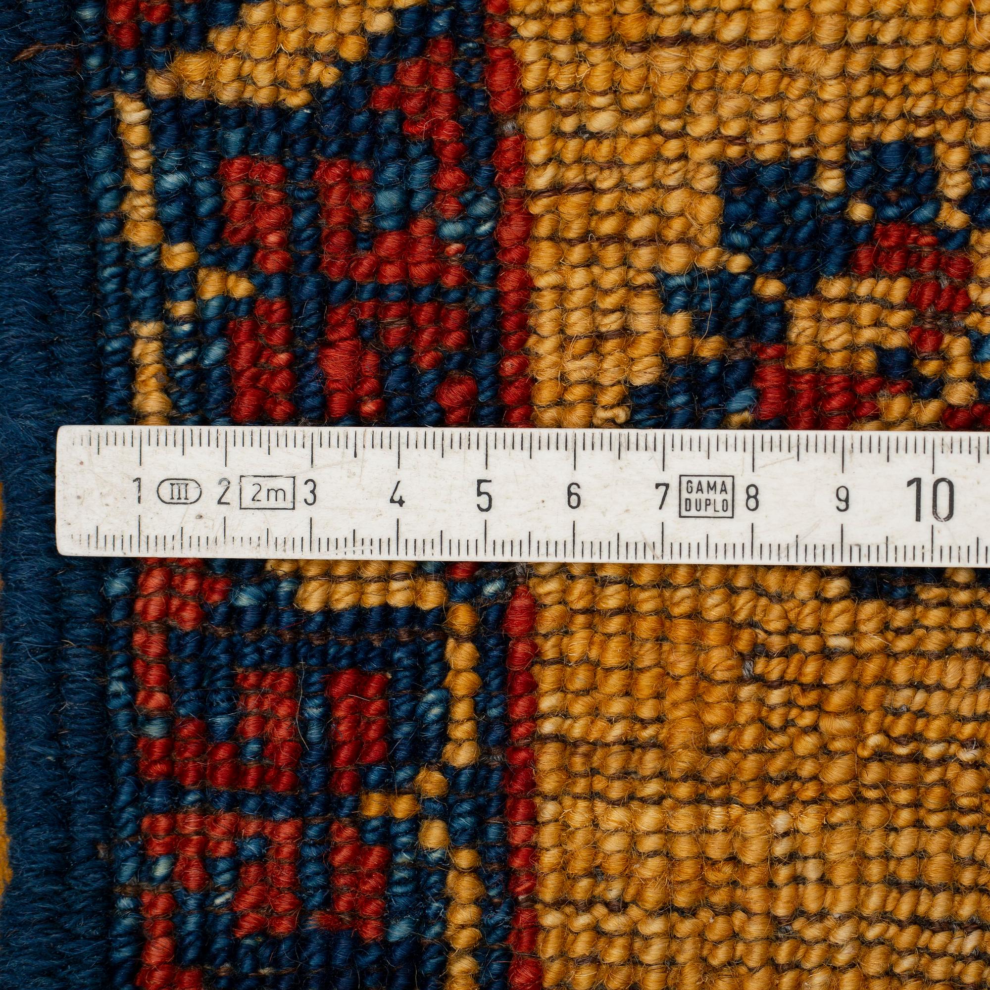 An oriental runner, ca 305 x 94 cm.