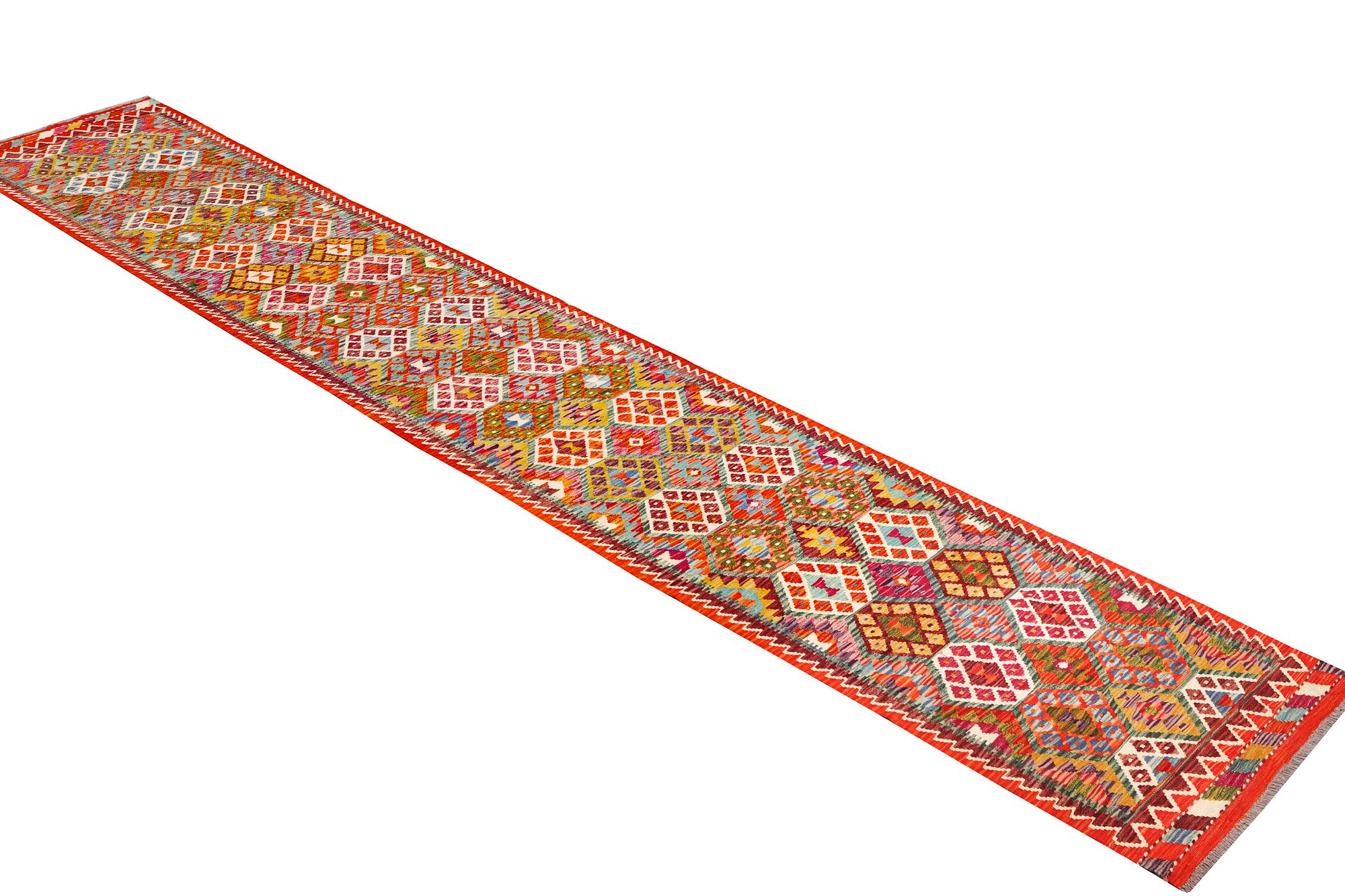 A Kilim carpet, c. 482 x 63 cm.