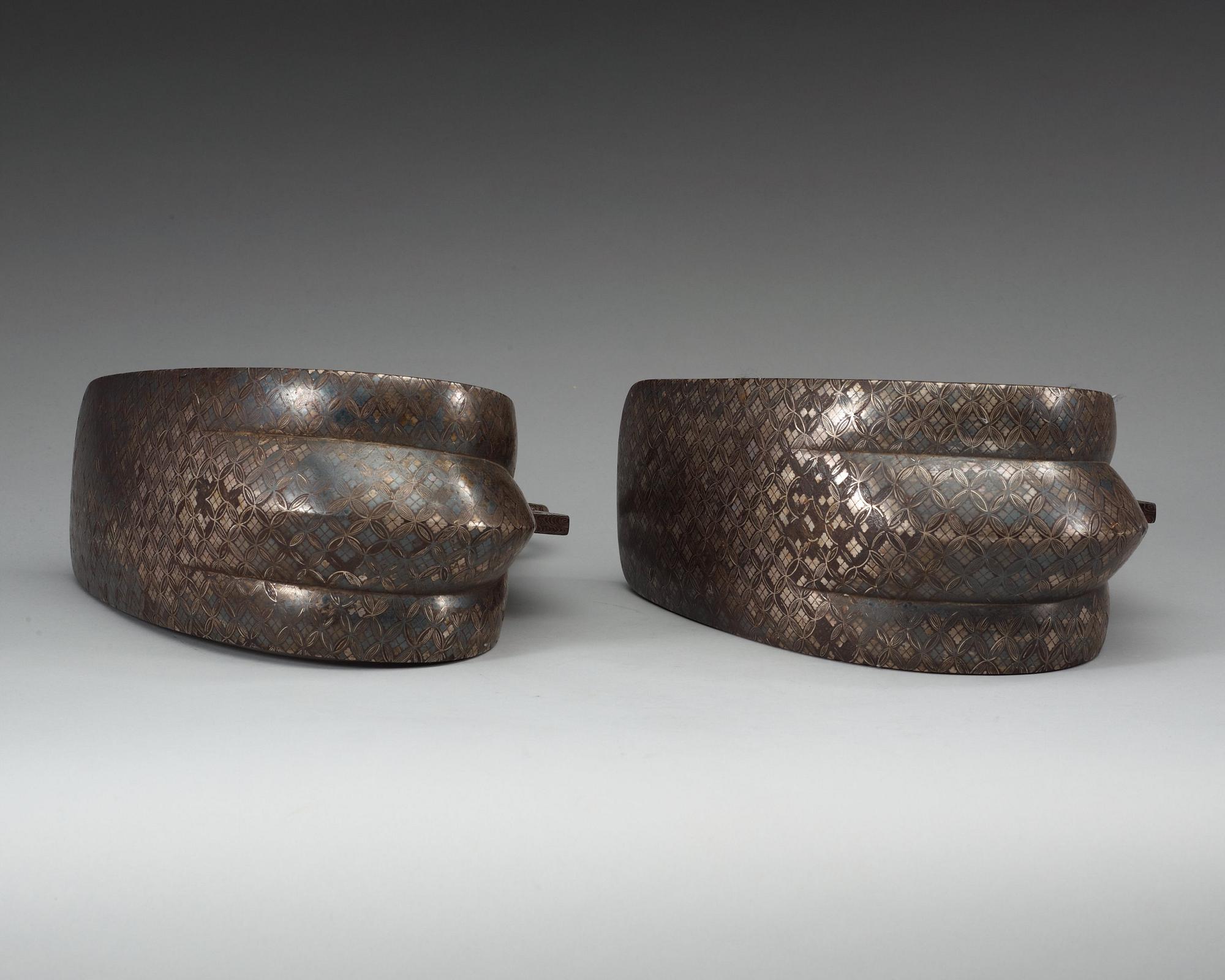 A pair of Japanese silvered bronze stirrups, Meiji (1868-1912).