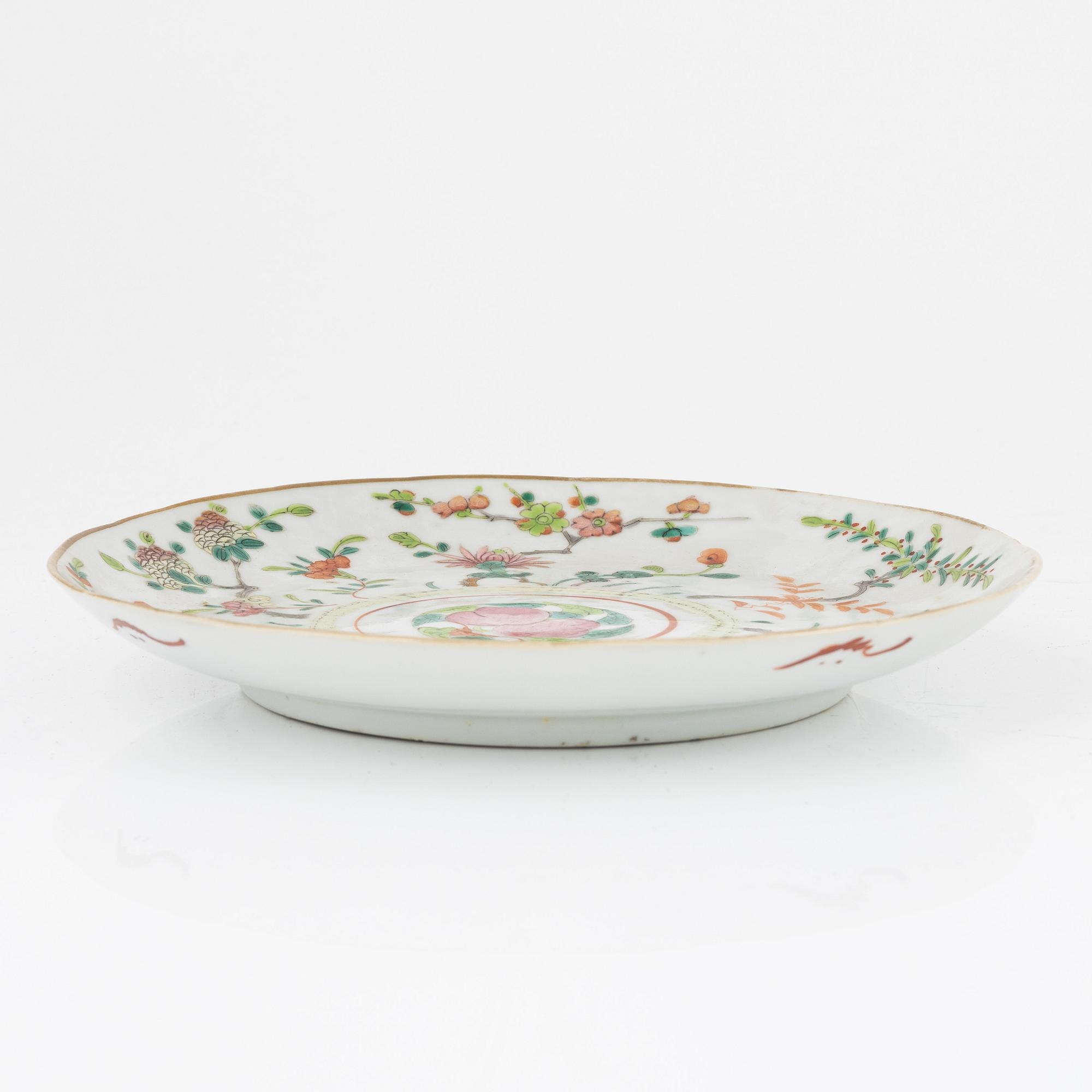 A set of three famille rose plates, Qing dynasty, circa 1900.