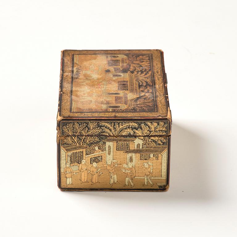 A lacquer tea box and a blanc de chine cup, Qing dynasty 18/19th century.