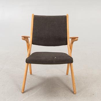 A Swedish oak and teak mid 1900s easy chair.