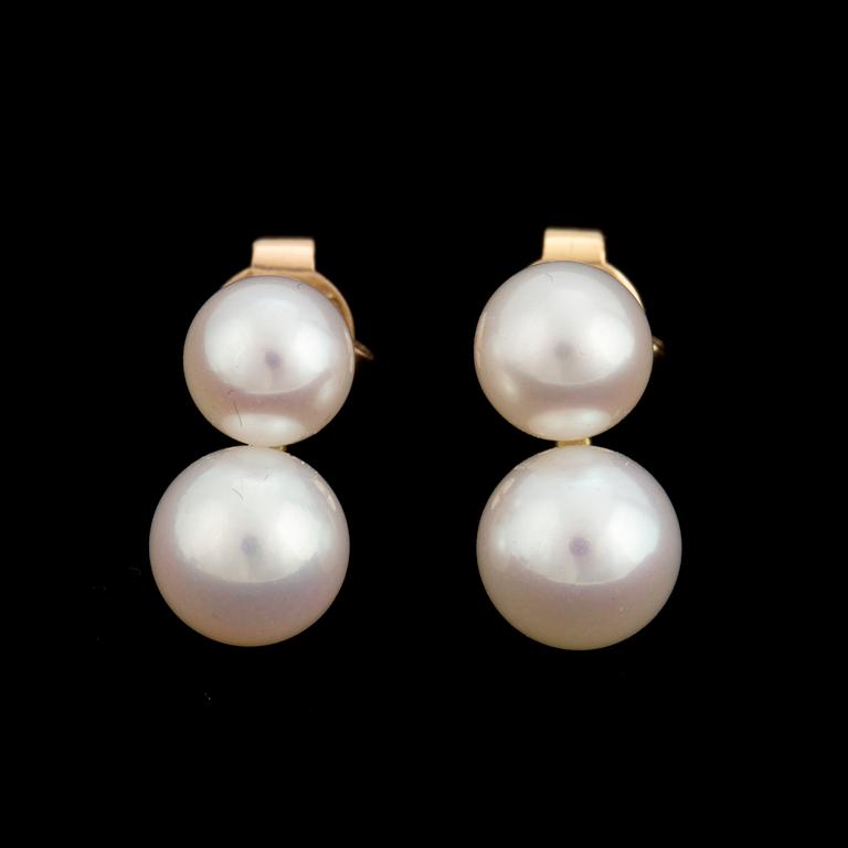 A pair of earrings with cultured pearls.