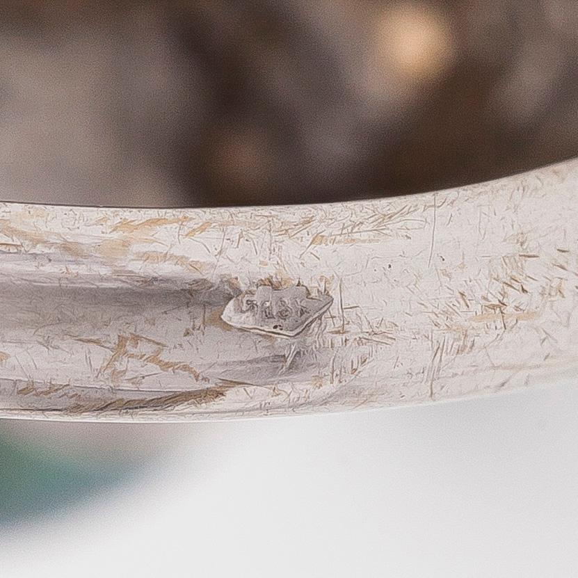 An 18K white gold ring with cultured Tahitian pearls.