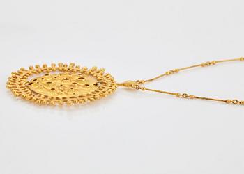 A Tapio Wirkkala pendant "Moon landscape" in 18K gold.