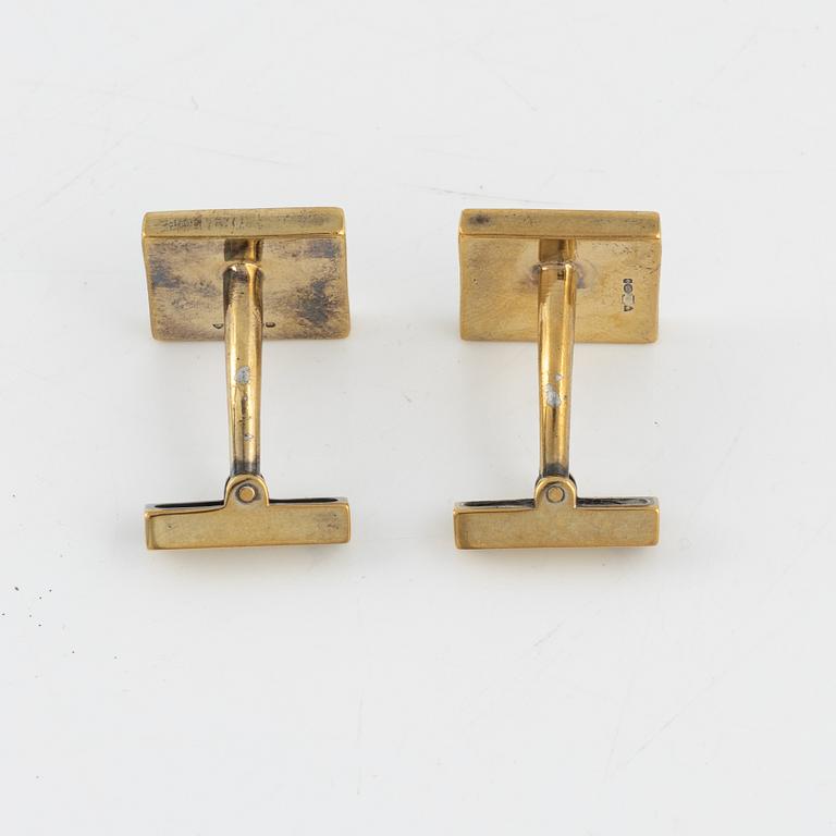 Louis Vuitton, a pair of gold plated silver cufflinks.
