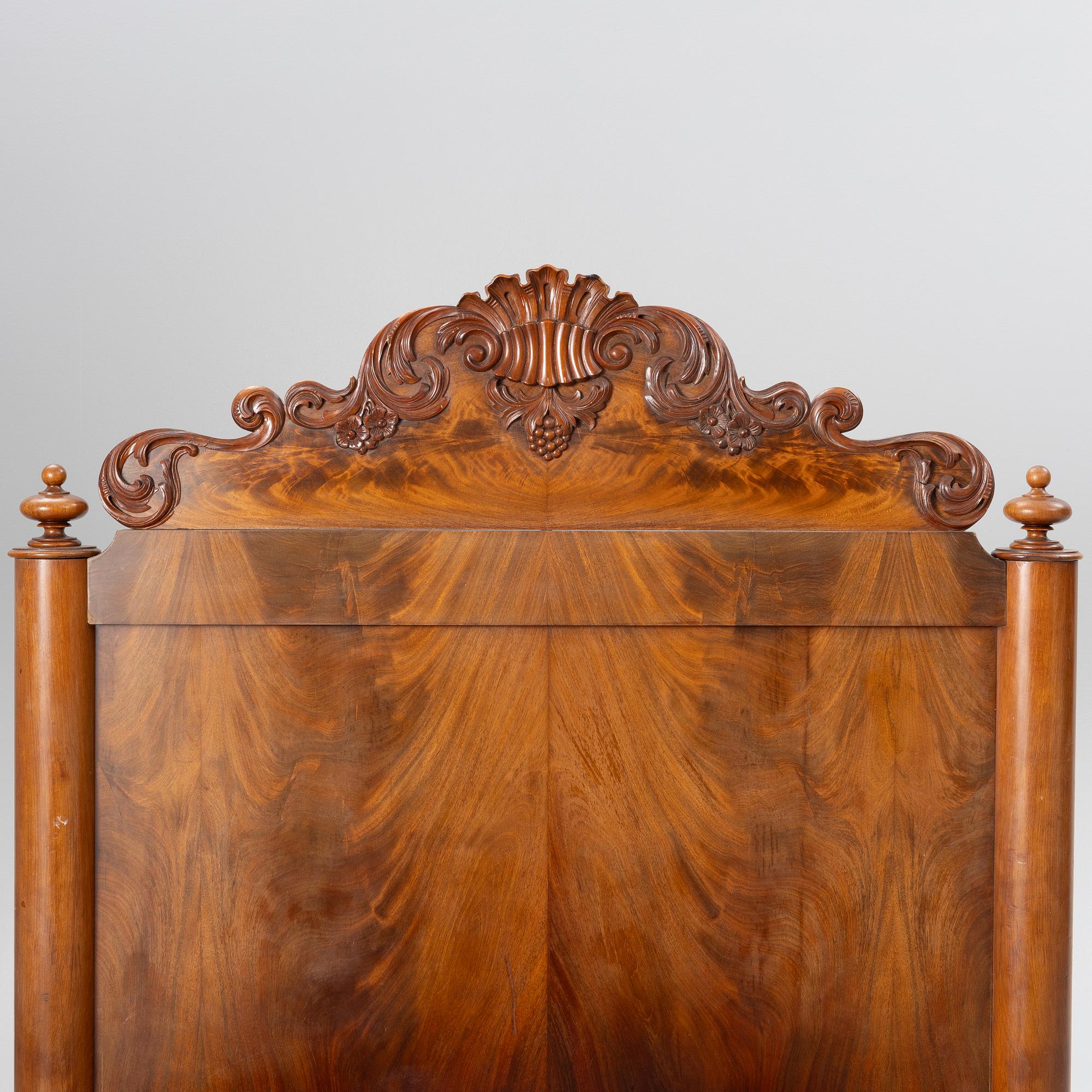 A late Empire bed, mid-19th century.