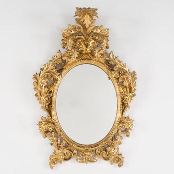 A 20th century Baroque style mirror.