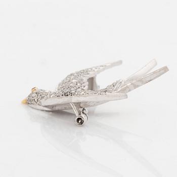 A platinum and gold brooch set with rose-cut dimonds and a ruby, in the form of a bird.